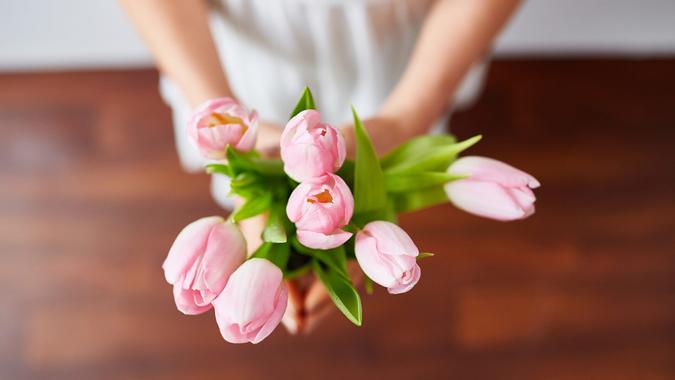 woman holding flowers