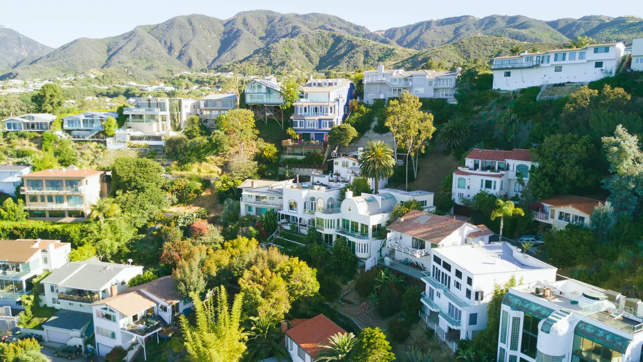 An aerial shot of beach front homes in Malibu, CA.