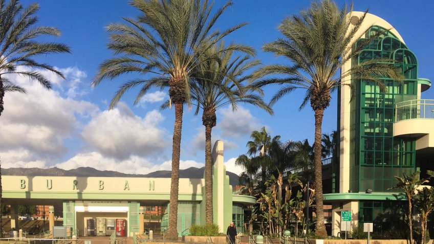 LOS ANGELES, CA, JAN 2017: detail of beautiful art deco Metrolink and Amtrak railway station with palm trees in Downtown Burbank.