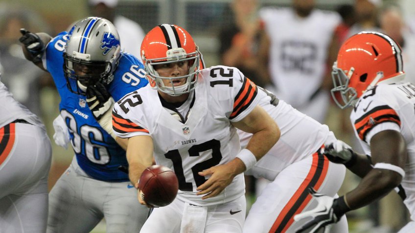 Colt McCoy Cleveland Browns quarterback Colt McCoy (12) handoffs during the first half of an NFL preseason football game against the Detroit Lions in DetroitBrowns Lions Football, Detroit, USA.