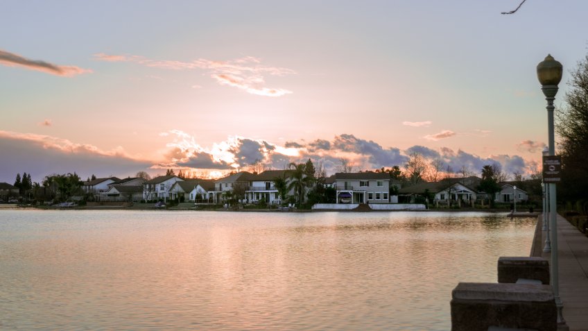 Sunset over man-made lake in Elk Grove California.