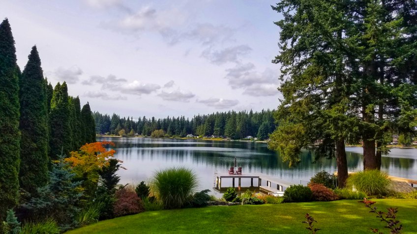Scenic lake view and forest in Everett from the backyard in sunset.