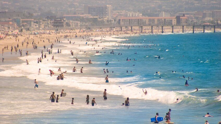 People frolicking on a summer's day at Hermosa Beach, California.