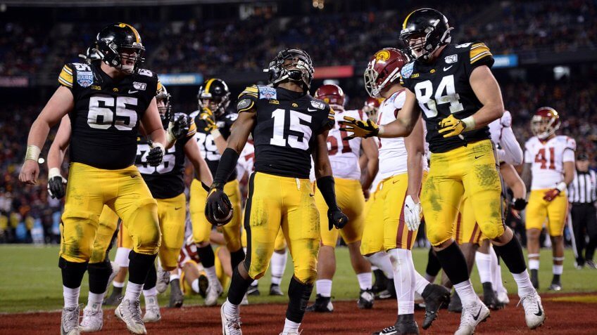 Mandatory Credit: Photo by Orlando Ramirez/AP/Shutterstock (10513794aa)Iowa running back Tyler Goodson (15) celebrates after scoring a touchdown during the second half against Southern California in the Holiday Bowl NCAA college football game, in San Diego.