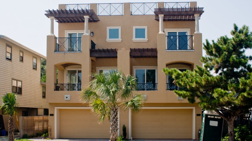 modern, newly constructed beach community home with roof top patio.