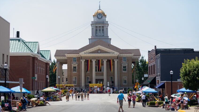 Jasper, Indiana, USA - August 5, 2018: The Strassenfest Parade, Photo of the Dubois County Courthouse, flying german flags, prior to the Strassenfest Parade.
