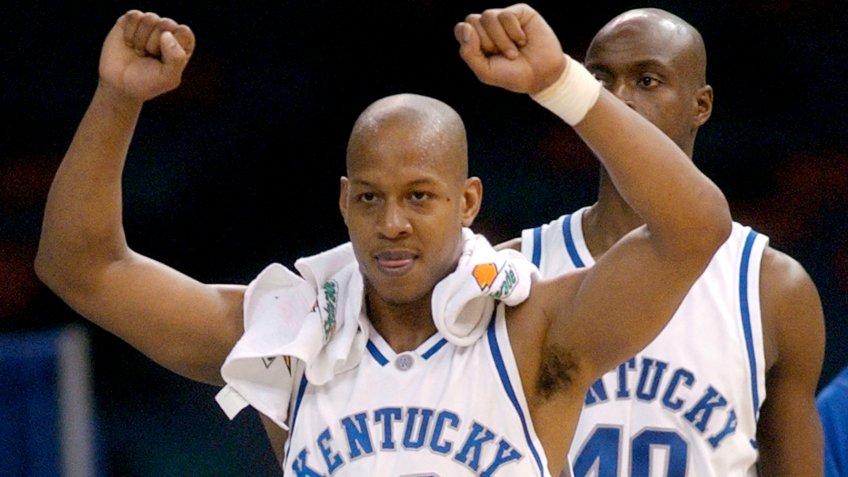 Kentucky's Keith Bogans (10) celebrates on the bench with teammate Jules Camara (40) in the second half in the championship of the SEC Conference tournament in the Superdome, in New Orleans.