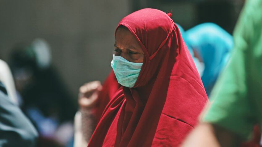 A Muslim pilgrim wears a surgical mask to prevent infection from respiratory virus known as the Middle East respiratory syndrome (MERS) in the holy city of Mecca, Saudi Arabia.