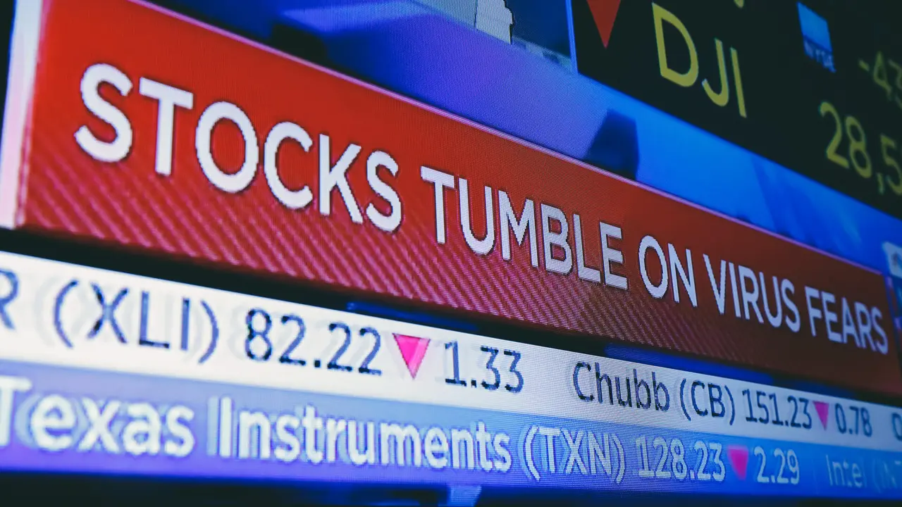 A television screen headlines trading on the floor of the New York Stock Exchange,.
