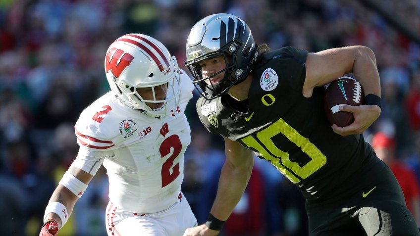 Mandatory Credit: Photo by Doug Benc/AP/Shutterstock (10516405g)Justin Herbert;Reggie Pearson.