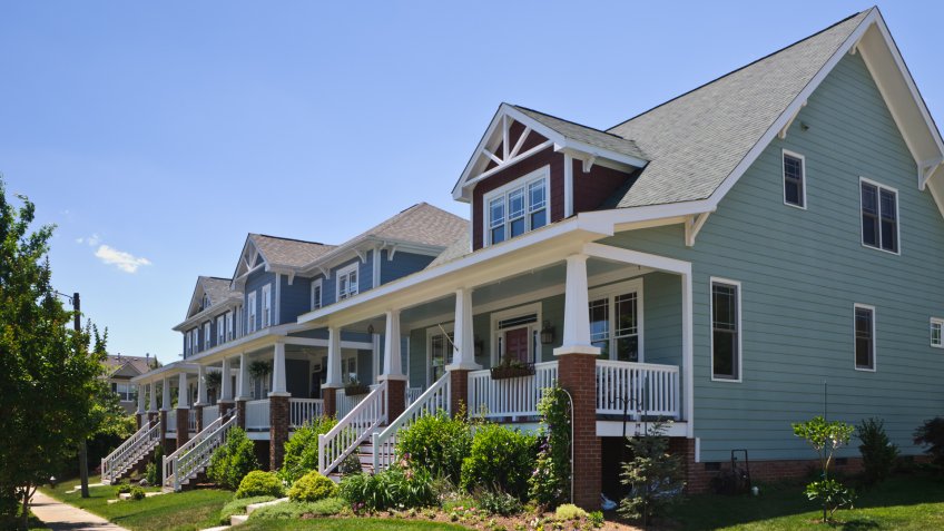 A new upscale neighborhood of single family homes on quiet tree lined streets near Raleigh, North Carolina feature an updated version of the classic Bungalow style home with wide front porches.