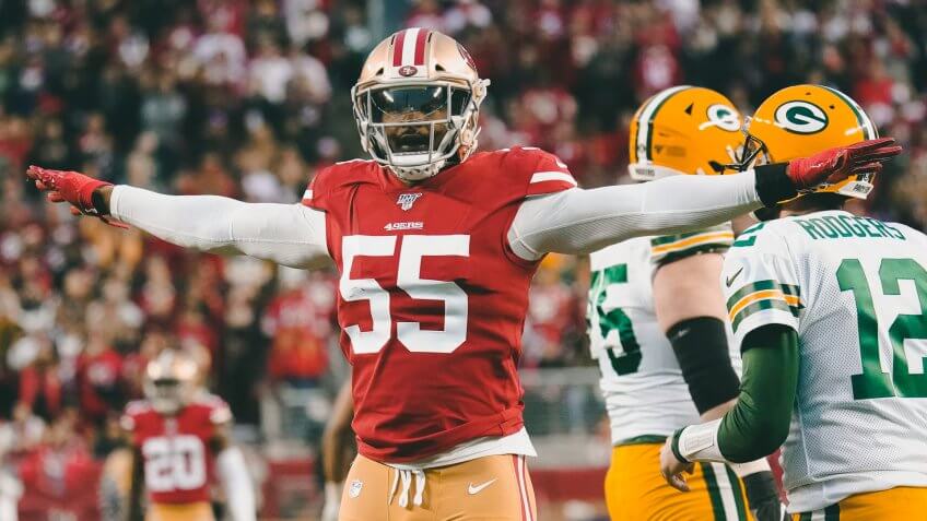 San Francisco 49ers defensive end Dee Ford (55) gestures next to Green Bay Packers quarterback Aaron Rodgers (12) during the first half of the NFL NFC Championship football game, in Santa Clara, CalifNFC Championship Packers 49ers Football, Santa Clara, USA - 19 Jan 2020.