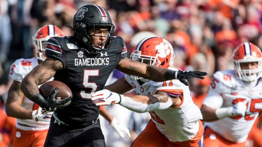 Mandatory Credit: Photo by Sean Rayford/AP/Shutterstock (10488737i)South Carolina running back Rico Dowdle (5) carries the ball against Clemson linebacker Isaiah Simmons (11) during the first half of an NCAA college football game, in Columbia, S.