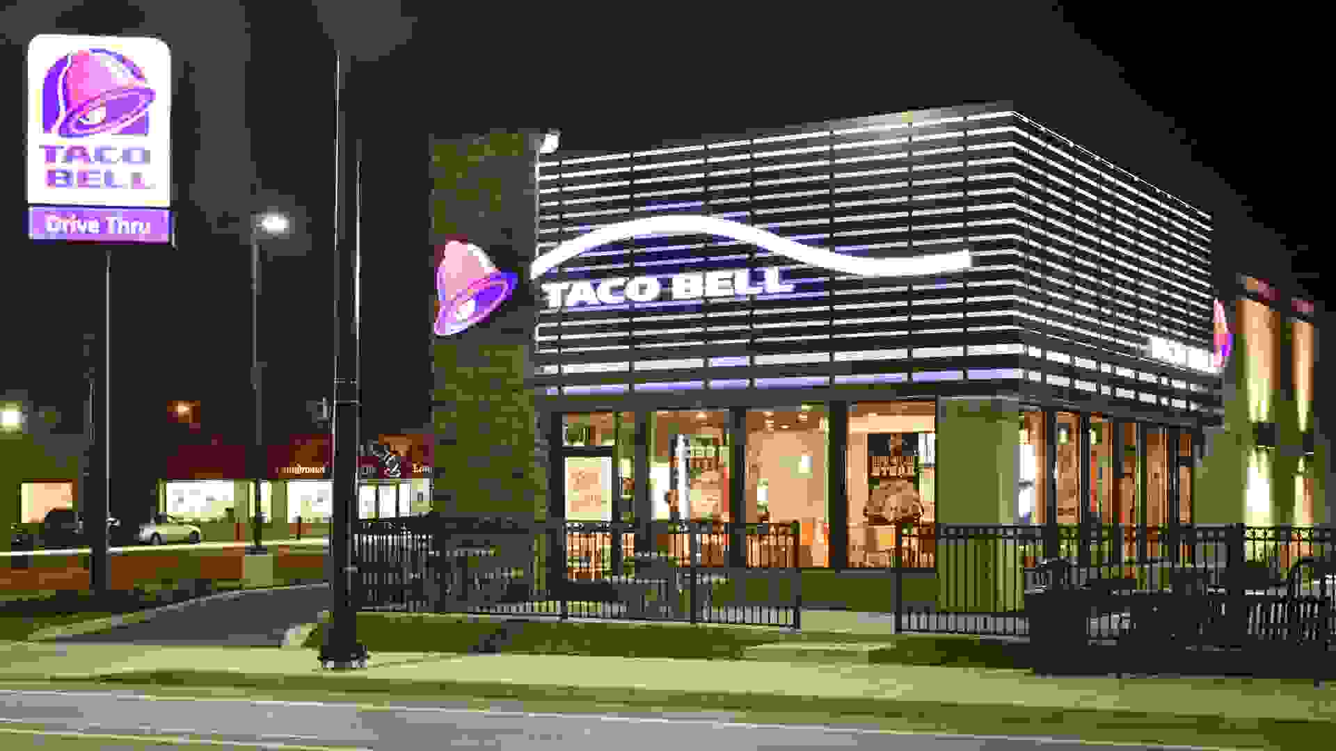 Dayton, Ohio, USA - December 13, 2015: Taco Bell Restaurant, shown here at night in its newer 2013 purple design, has recently announced its implementation of exclusively using cage-free eggs in its 6000 US locations by the end of 2016.