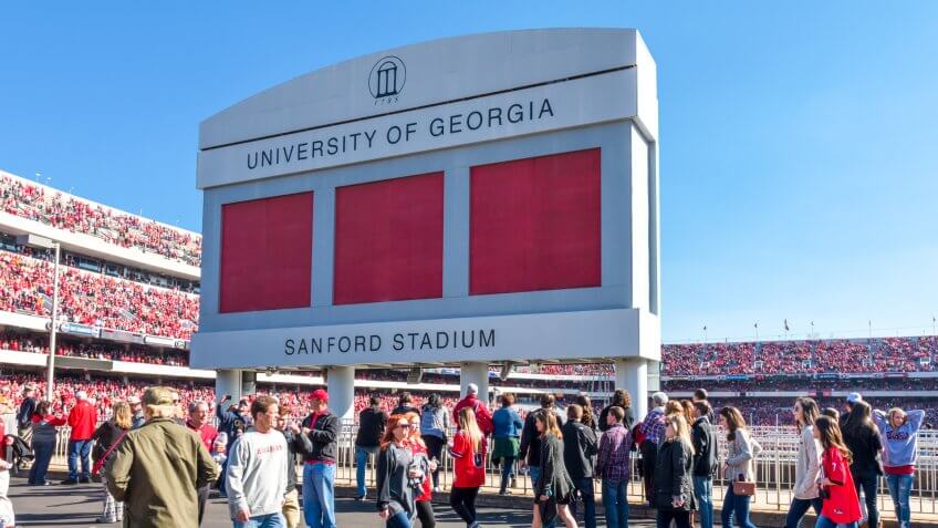 Athens, Georgia, United States: November 26, 2017: Crowd passes under Sanford Stadium Sign on Game Day.