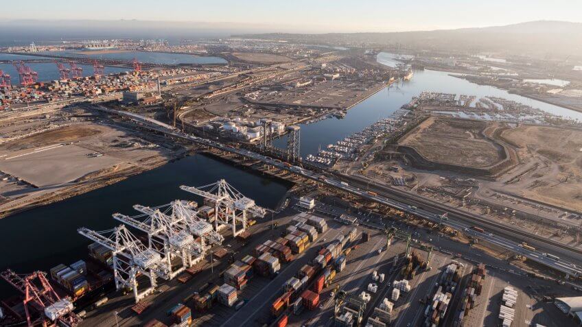 Los Angeles, California, USA - August 16, 2016: Aerial view of port cranes, containers and cargo facilities in Wilmington and Terminal Island.
