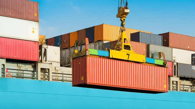 Cargo ship being loaded with containers at port in Chile.
