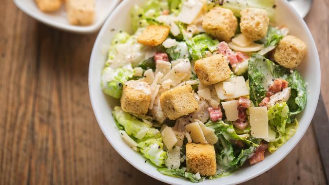 Chicken Caesar salad with bacon, parmesan and croutons.