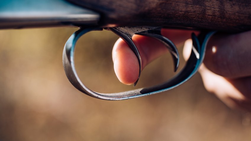 finger holding the trigger