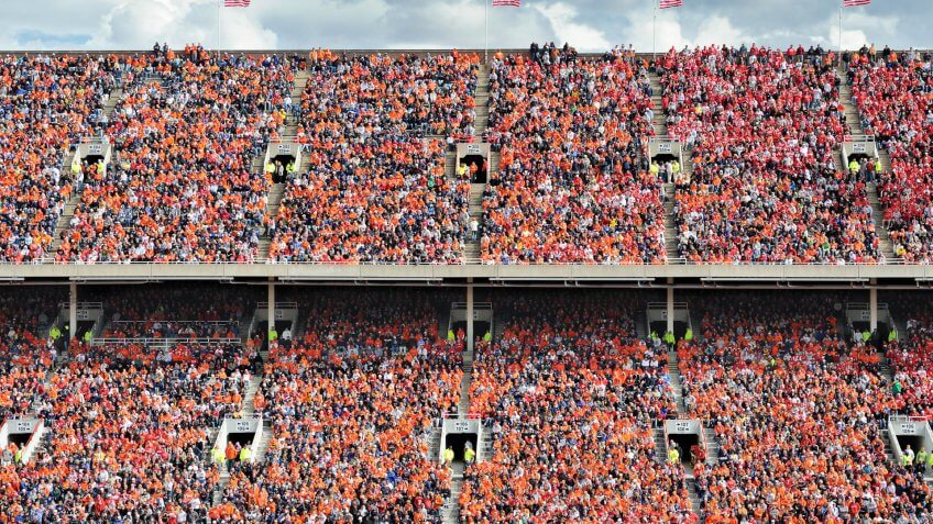football fans stand in the nosebleed section