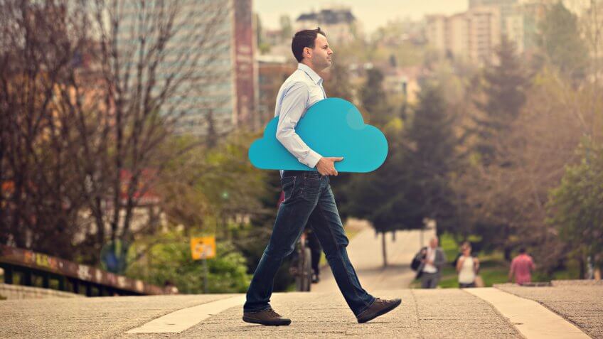 Young man with blue cloud on the street.