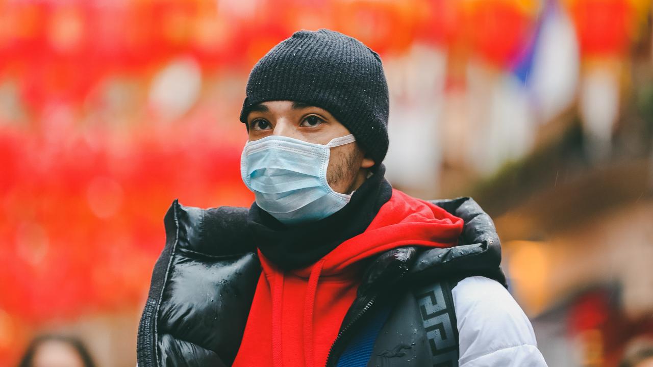 A man in Chinatown in central London is seen wearing a face mask following the outbreak of Coronavirus in China which has killed 41 people.