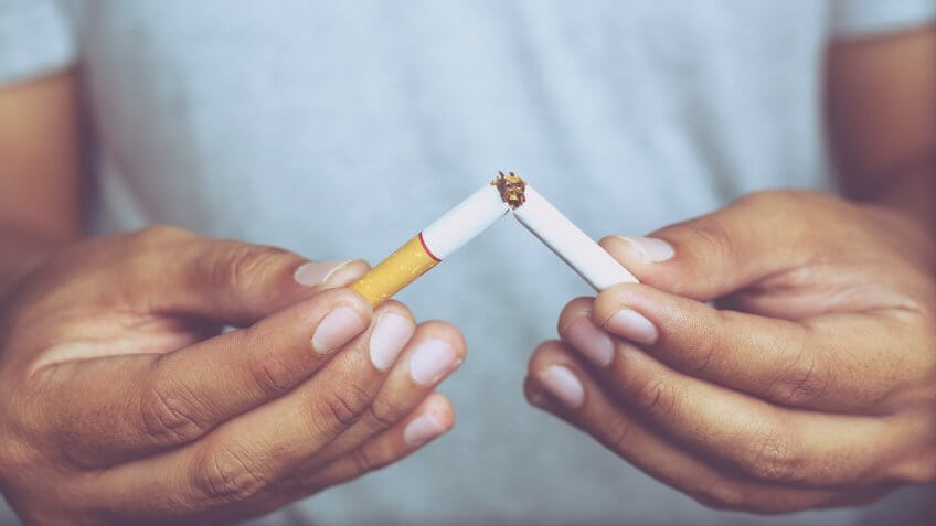 Man refusing cigarettes concept for quitting smoking and healthy lifestyle.