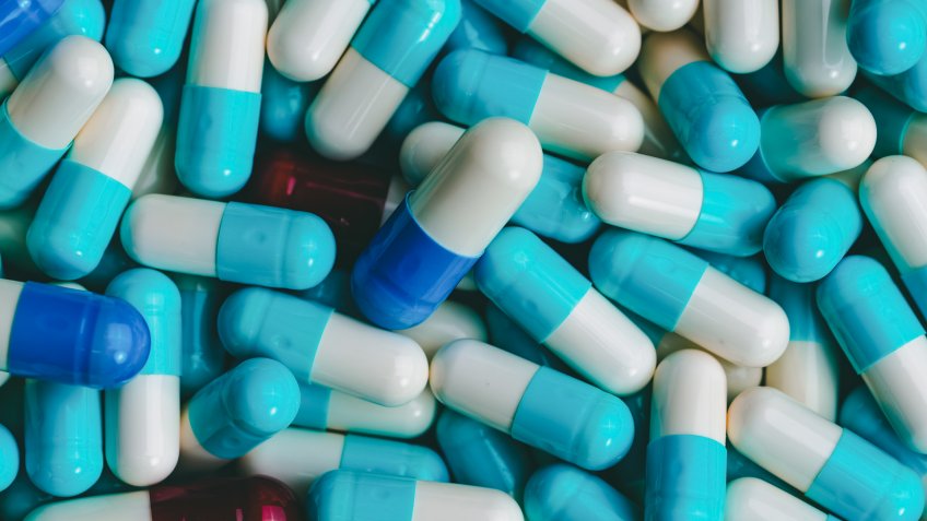 Pile of antibiotic capsule pills.