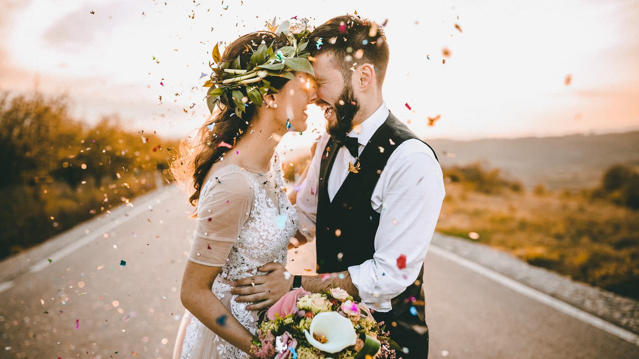 wedding couple in love with confetti