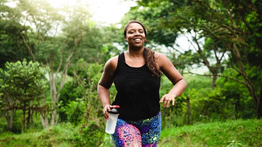 Brazilian woman body positive exercising in nature.