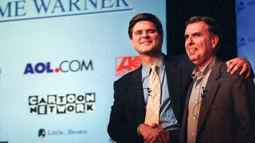 Steve Case, Gerald Levin, AOL, Time Warner Then AOL chairman and chief executive, Steve Case, left, and Time Warner's the chairman and chief executive, Gerald Levin, shake hands before a news conference to announce the merger of the two companies, in New York.