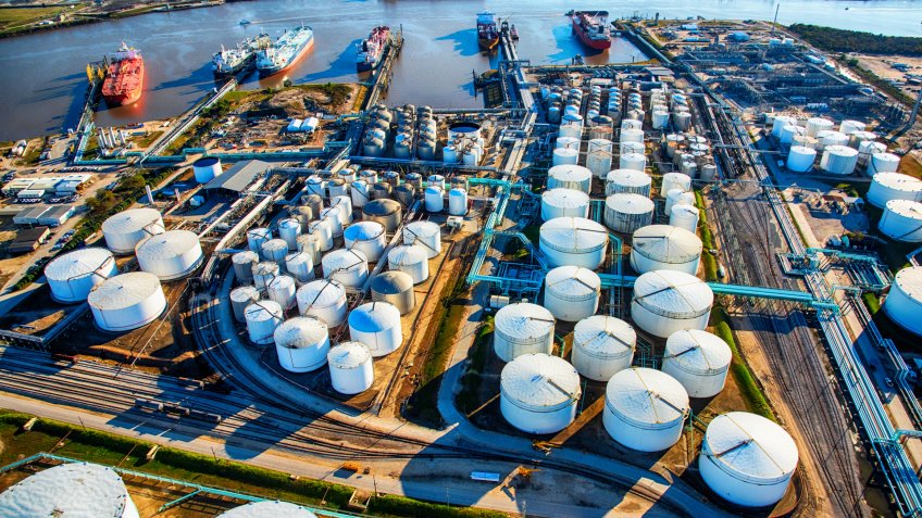 A group of large sea baring oil tankers moored at a Texas oil refinery near Trinity Bay just outside of Houston, Texas, loading oil for export throughout the world.