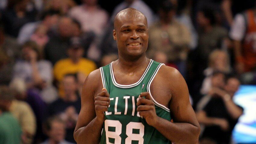 WALKER Boston Celtics forward Antoine Walker grins at his team's bench after missing the final shot in regulation against the Phoenix Suns, at America West Arena in Phoenix.