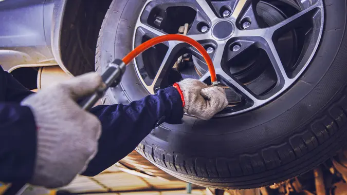 Car Tire Pressure Check in the Auto Service Garage.