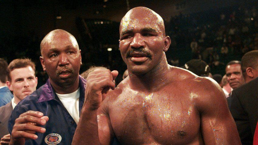 HOLYFIELD Evander Holyfield raises his fist after defeating Mike Tyson in their WBA Heavyweight Championship bout at the MGM Grand Garden in Las Vegas, NevTYSON HOLYFIELD, LAS VEGAS, USA.