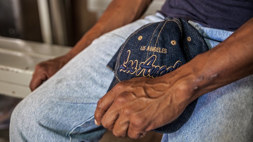 Hands of an undocumented worker from Central America in a soup kitchen in Sonora, Mexico, who is about to cross into the US without papers.