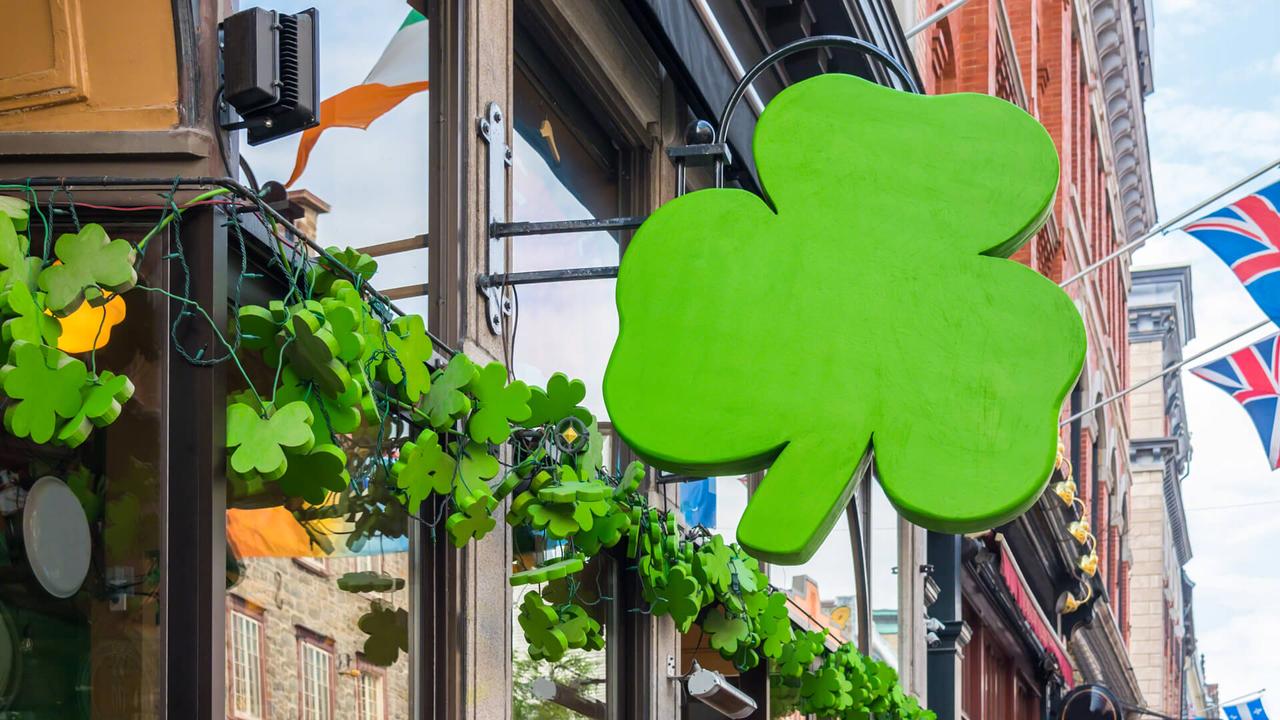 Outside street view of irish pub decorated with shamrocks for St Patricks Day.