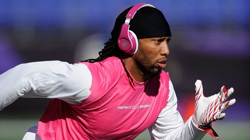Arizona Cardinals wide receiver Larry Fitzgerald warms up while wearing pink headphones in support of breast cancer awareness before a NFL football game against the Baltimore Ravens in BaltimoreCardinals Ravens Football, Baltimore, USA - 30 Oct 2011.
