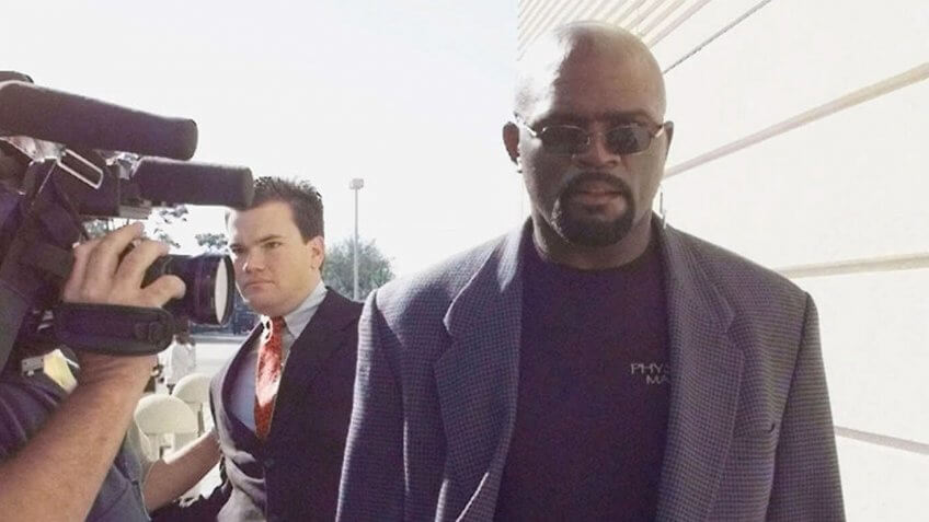 TAYLOR NFL Hall of Famer and former New York Giants player Lawrence Taylor, right, walks through a line of photographers as he heads into the Pinellas County courthouse in Clearwater, Fla.
