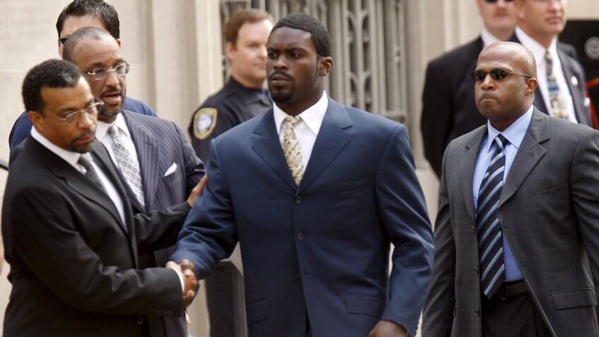 Nfl Quarterback Michael Vick Shakes Hands with His Lawyers As He Arrives at the U S District Court House to Plead Guilty to a Federal Conspiracy Charge That He Helped Run an Interstate Dogfighting Operation in Richmond Virginia Usa 27 August 2007 the Nfl On 24 August Suspended Vick Indefinitely Without Pay After He Filed the Plea Agreement with League Commissioner Roger Goodell Calling the Operation 'Cruel and Reprehensible'Usa Vick Trial - Aug 2007.
