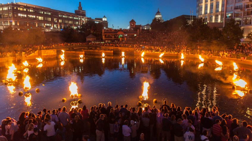 "Providence, Rhode Island, USA - August 24, 2013: People line the banks of the Providence River to enjoy Waterfire.