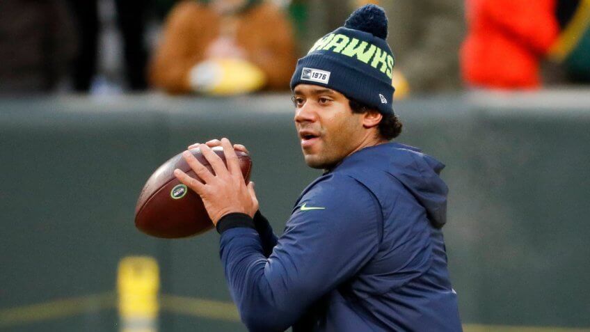 Seattle Seahawks quarterback Russell Wilson warms up before an NFL divisional playoff football game against the Seattle Seahawks, in Green Bay, WisSeahawks Packers Football, Green Bay, USA - 12 Jan 2020.