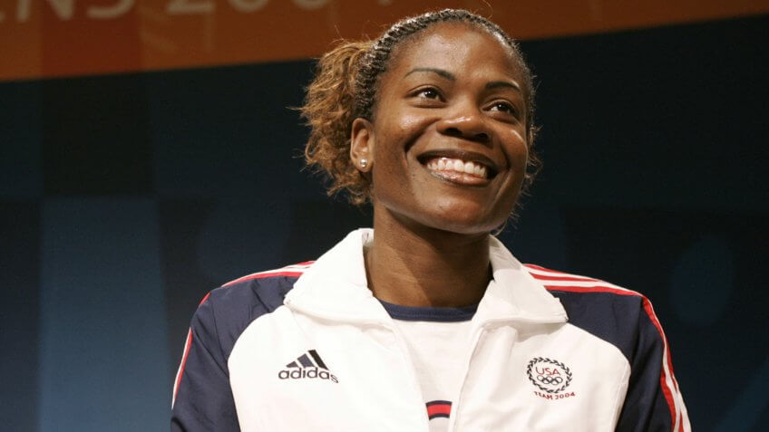 Basketball star Sheryl Swoopes smiles during a team news conference in AthensGREECE OLYMPICS BASKETBALL, ATHENS, Greece.