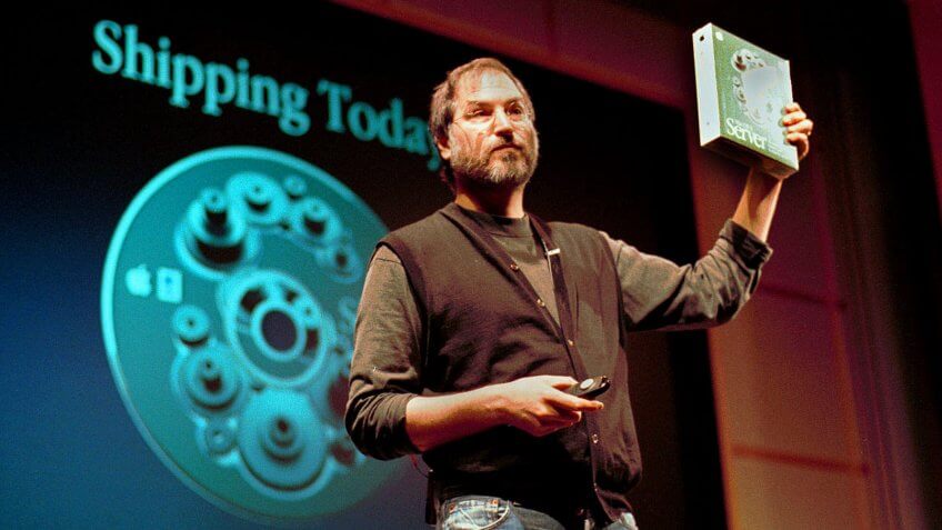 STEVE JOBS Steve Jobs, President and CEO of Apple Computer, holds a copy of his company's new software, OS X server, at a media conference, in Cupertino, CalifSteve Jobs, SAN FRANCISCO, USA.