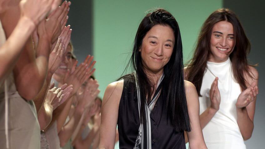 WANG Designer Vera Wang, center, as she is applauded by her models and the audience following the presentation of her spring-summer 2003 collection in New York.