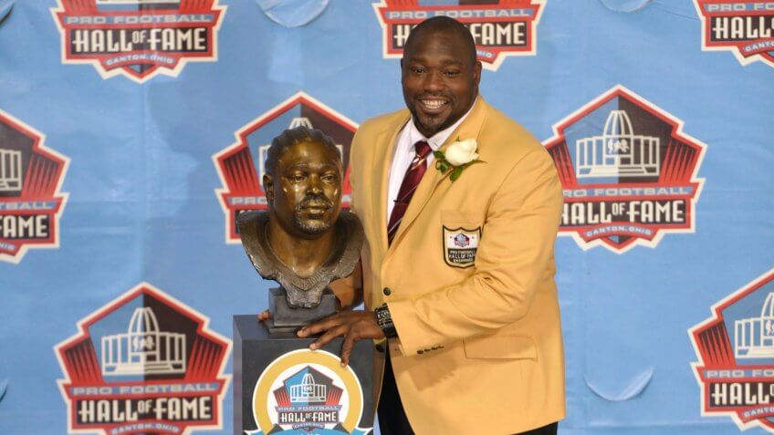 Hall of Fame inductee Warren Sapp poses with his bust during the 2013 Pro Football Hall of Fame Induction Ceremony, in Canton, OhioHall of Fame Football, Canton, USA - 3 Aug 2013.