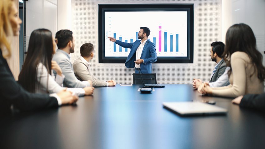 Closeup of a board room meeting at a business company, usual scene at any modern company.