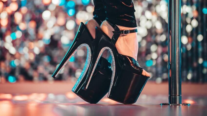 Legs in high sexy shoes near pylone.