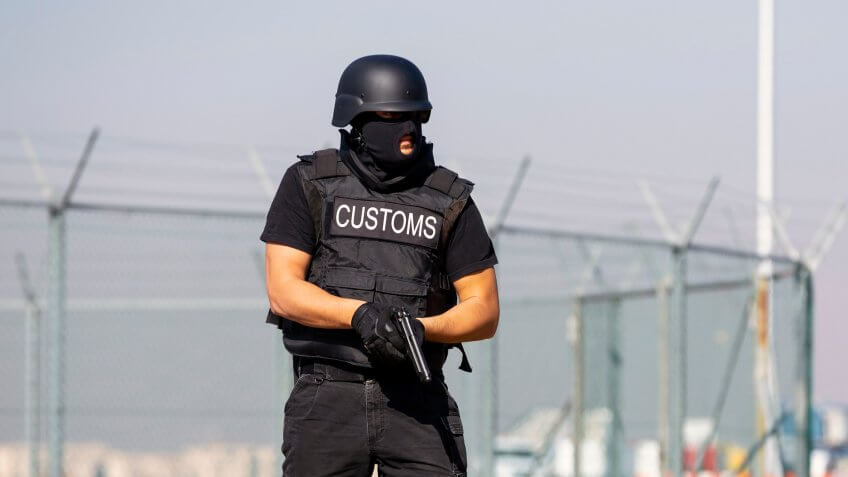 Customs and border protection officer and Drug enforcement administration special force participates in a training at the airport for searching and seizing of illegal drugs.