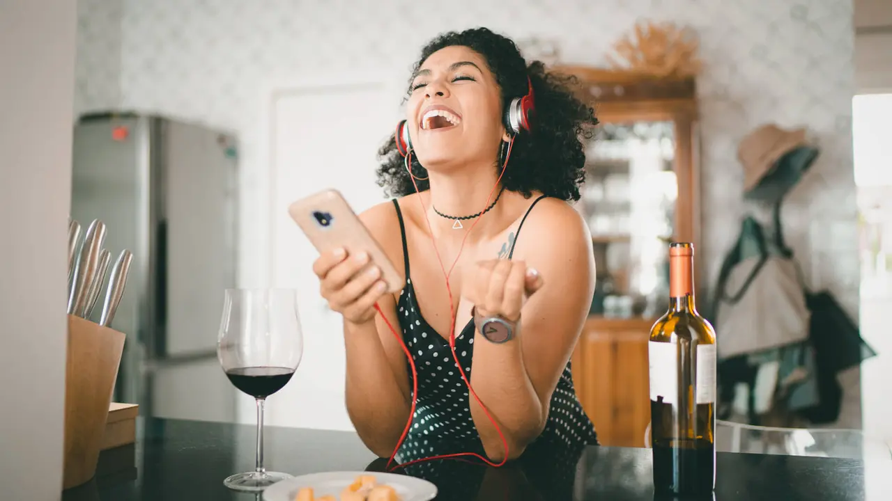 Woman Listening Music at Home.